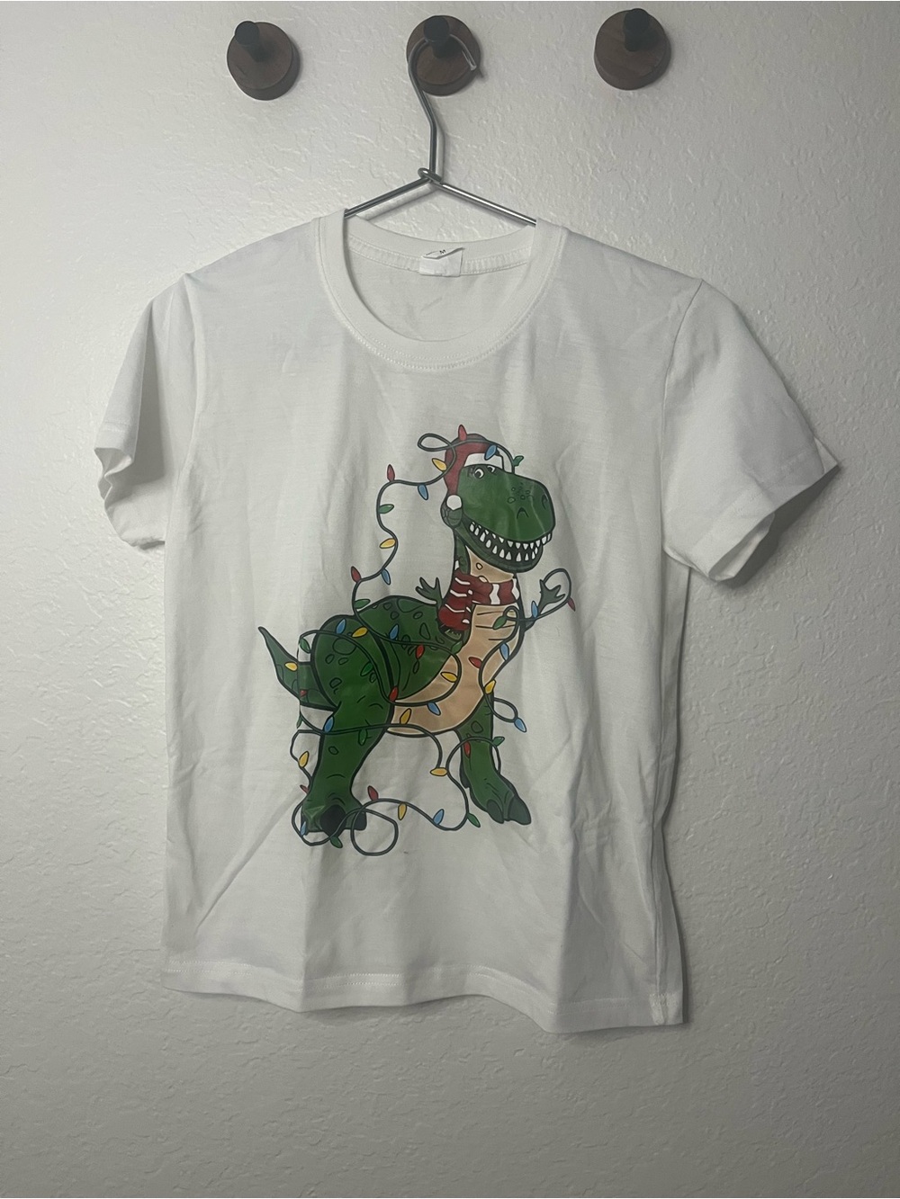 Amazon White Kids Tee with Green Dinosaur & Multicolor Holiday Lights